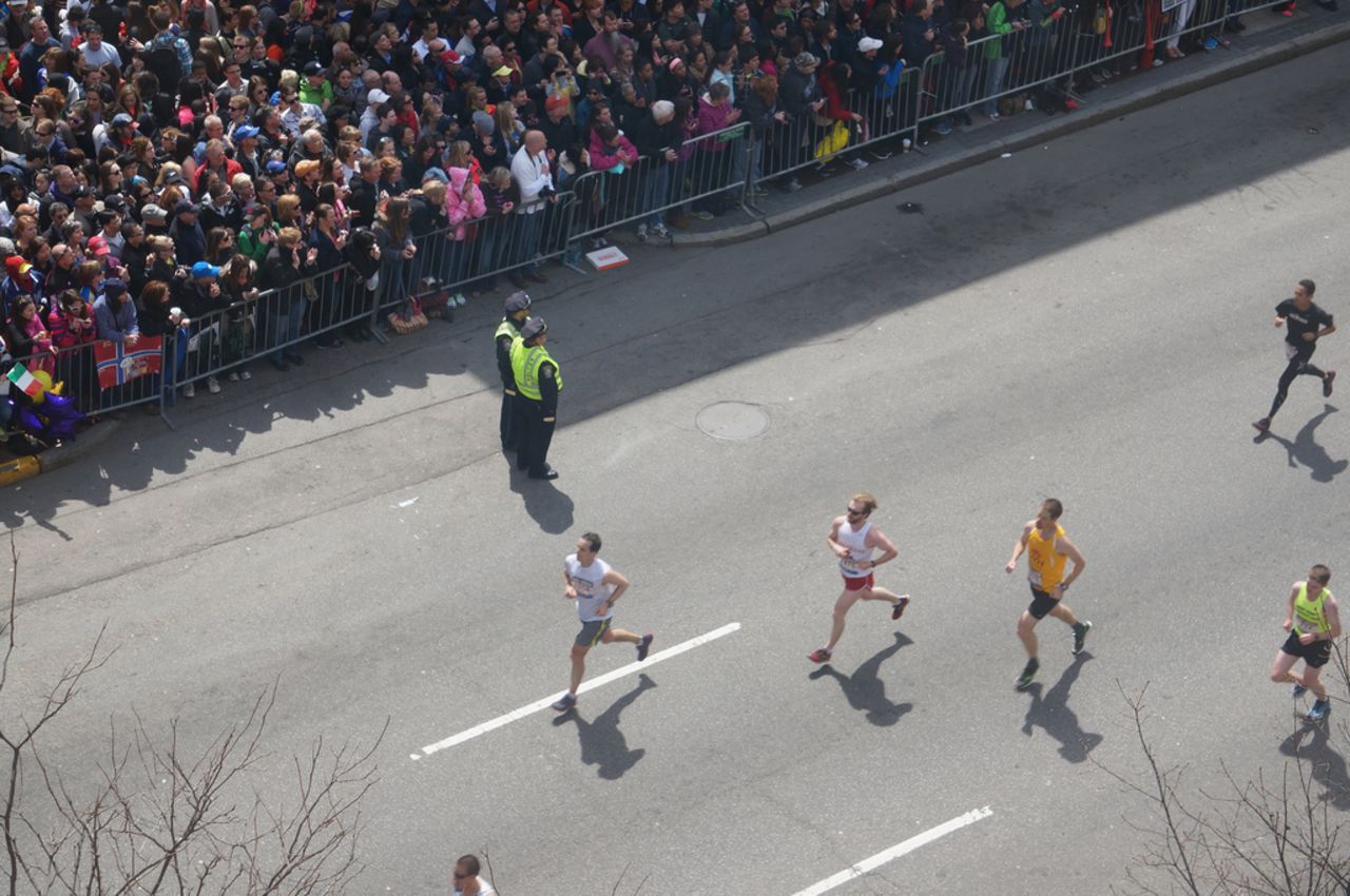 Runners pass by.