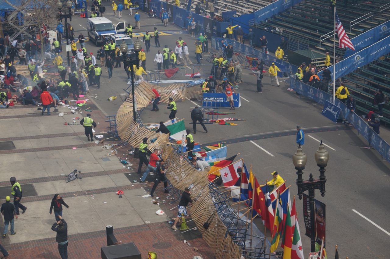 Workers clear a fence.