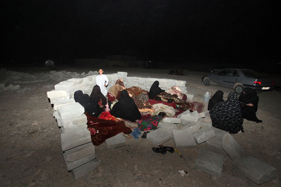 Iranian residents take shelter in a field after the earthquake in the city of Saravan in southeastern Iran on Tuesday, April 16.