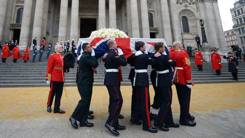Members of the British armed services carry the coffin of former <a href="index.php?page=&url=http%3A%2F%2Fwww.cnn.com%2F2013%2F04%2F17%2Fworld%2Feurope%2Fuk-margaret-thatcher-funeral%2Findex.html">Prime Minister Margaret Thatcher</a> away from St Paul's Cathedral in London after a ceremonial funeral on Wednesday, April 17. Thatcher, 87, died after a stroke on April 8. She was prime minister from 1979 to 1990.