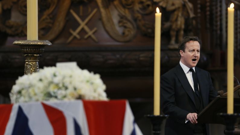 British Prime Minister David Cameron delivers a reading during the service.