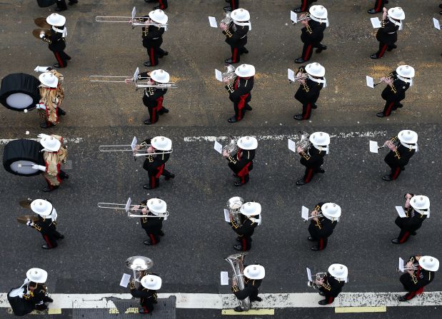 A military band marches past on Fleet Street.