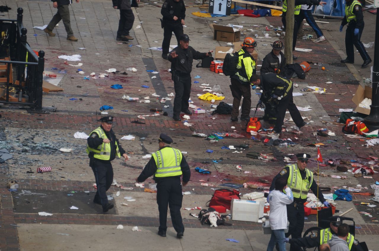 Glass and blood cover the ground.