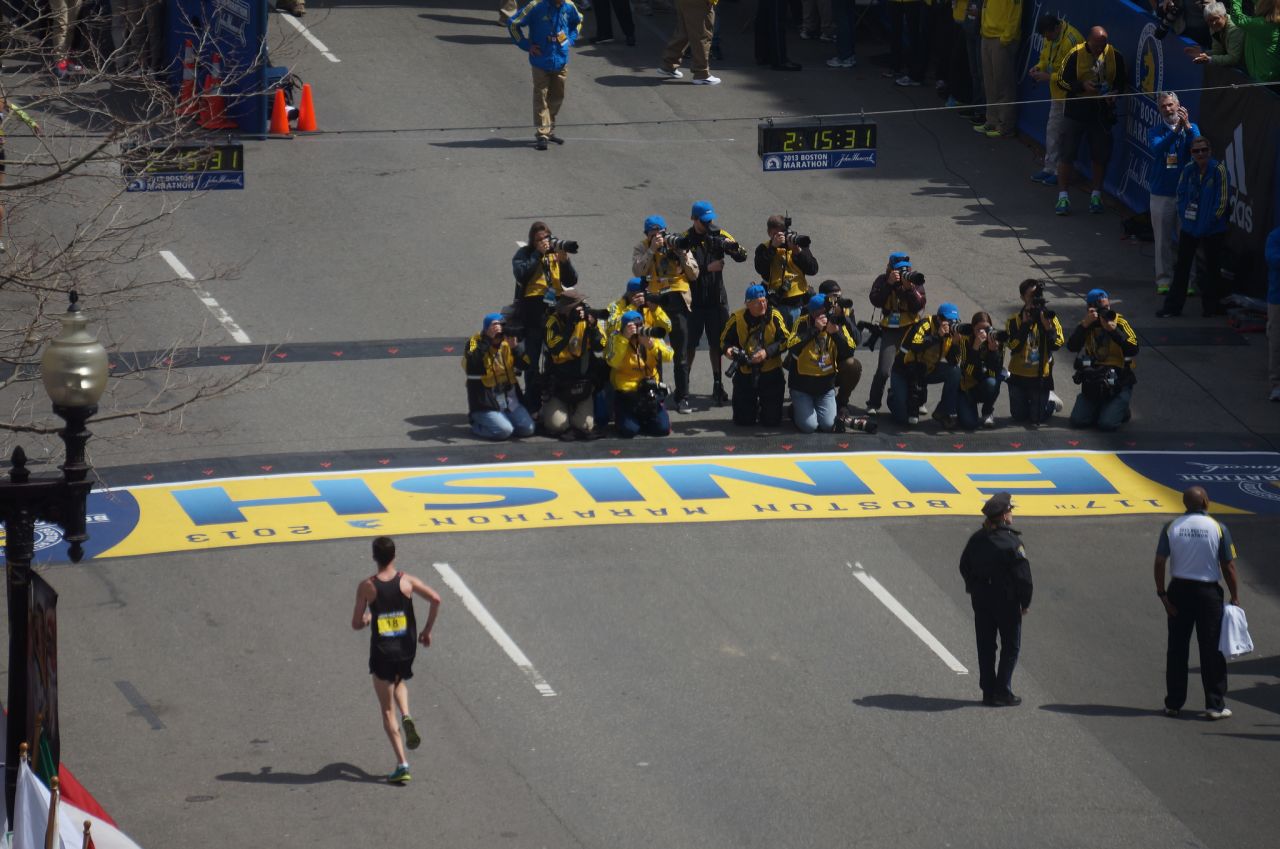 A herd of photographers captures the big race.