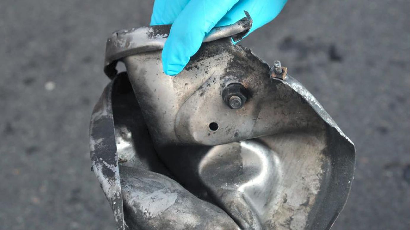 Boston Marathon bomb scene pictures, taken by investigators, show the remains of an explosive device.