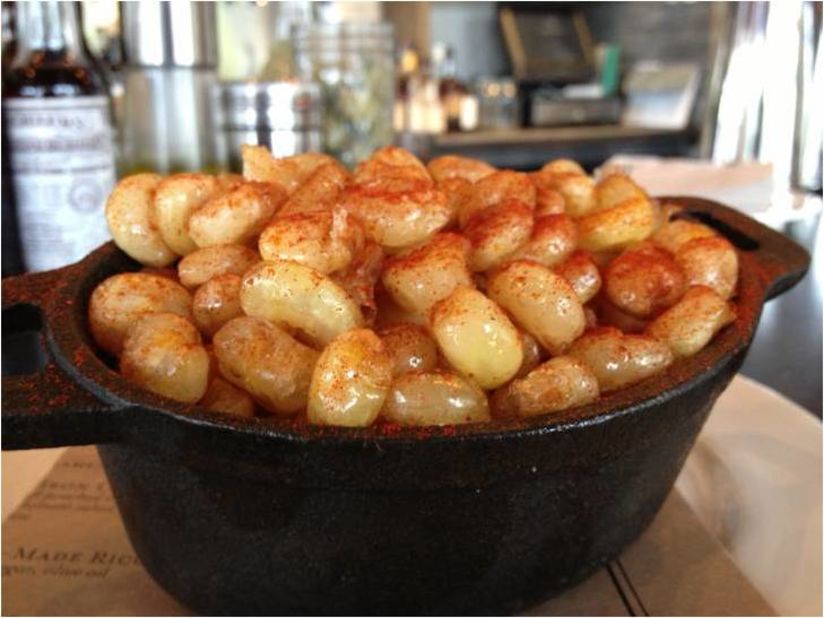 At Yardbird Southern Table & Bar in Miami, crunch-fried hominy is the snack that keeps drinkers sated, free of charge.