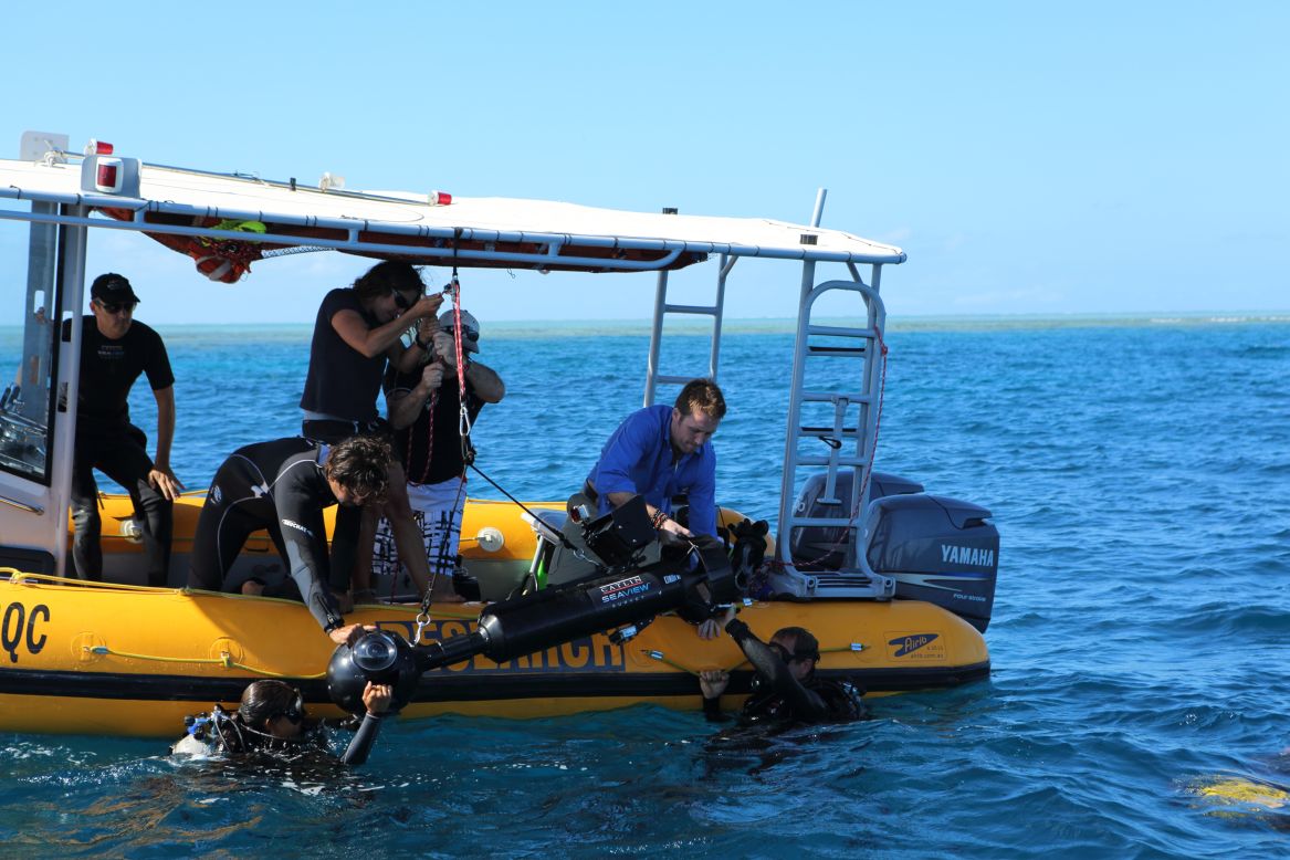 Philippe Cousteau and team prepare for a dive in waters off the Great Barrier Reef.