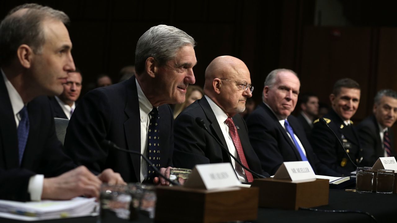 From left, National Counterterrorism Center Director Matthew Olsen, FBI Director Robert Mueller, Director of National Intelligence James Clapper, and CIA Director John Brennan, Defense Intelligence Agency Director Lt. Gen. Michael Flynn, and Assistant Secretary of State for Intelligence and Research Philip Goldberg testify during a hearing before a Senate committee March 12, 2013.