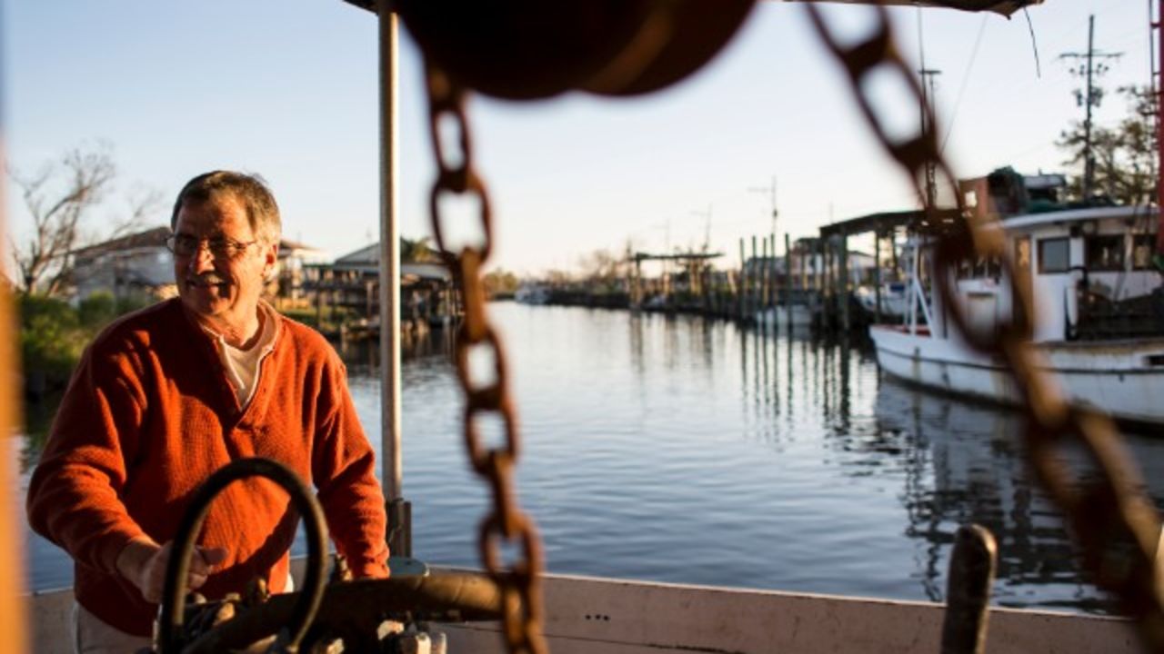 George Barisich pilots his oyster boat on Bayou Yscloskey, in St. Bernard Parish, Louisiana.