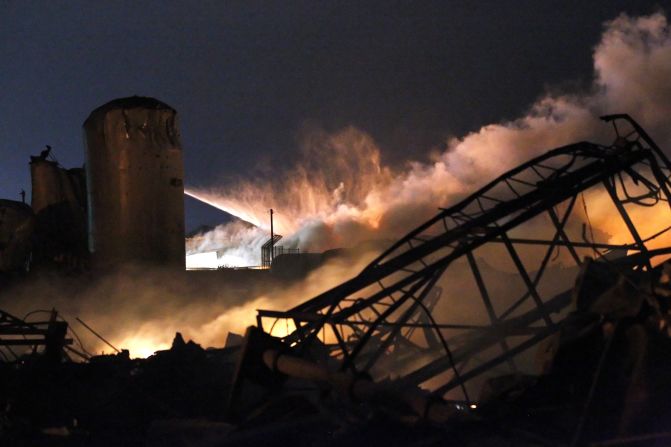 Water is sprayed on the remains of the plant.