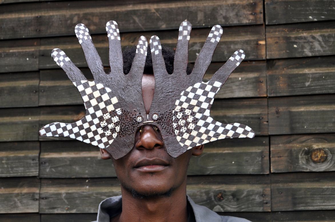Award-winning Ugandan photographer Papa Shabani says "Cyrus is a different new breed with original works." The self-taught artist, pictured wearing his creations, used to exchange his art with students who would do his homework for him. <br />