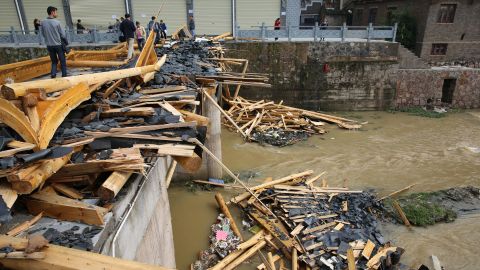 Debris litters a river after a tornado and hailstorm hit Zhenyuan County in China's southwest Guizhou Province on April 18.