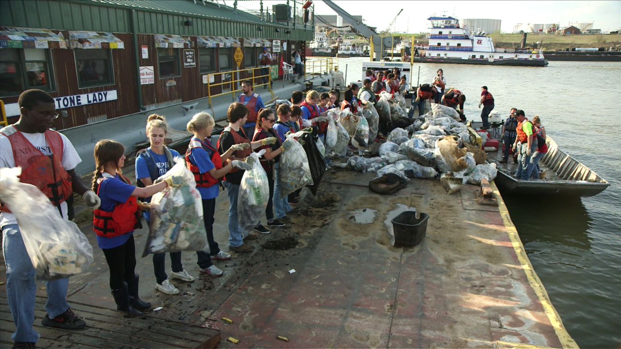 Volunteers in Memphis, Tennessee, sort out the garbage from a recent Mississippi River cleanup.