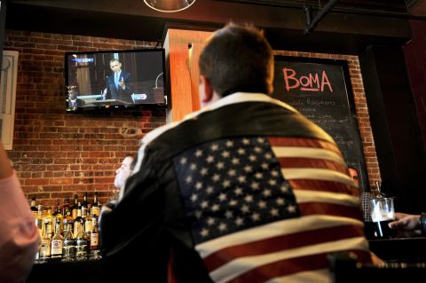 A man at a Boston restaurant watches Obama speak on television on April 18, 2013.
