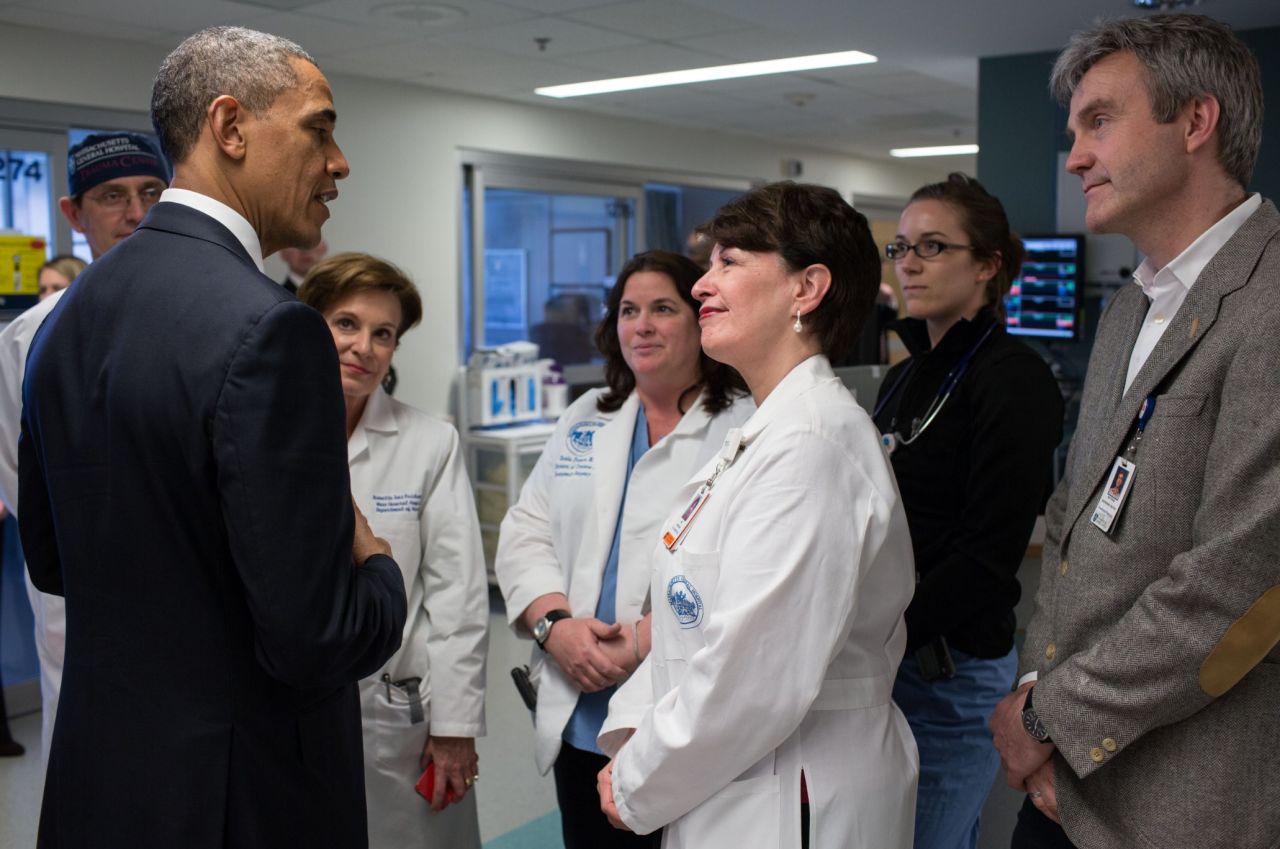 Obama talks with staff members at Massachusetts General Hospital while visiting injured patients on April 18, 2013.