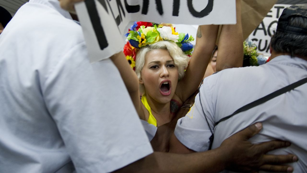 (File photo) Topless activists of the women's rights group Femen in Rio de Janeiro on February 8, 2013.