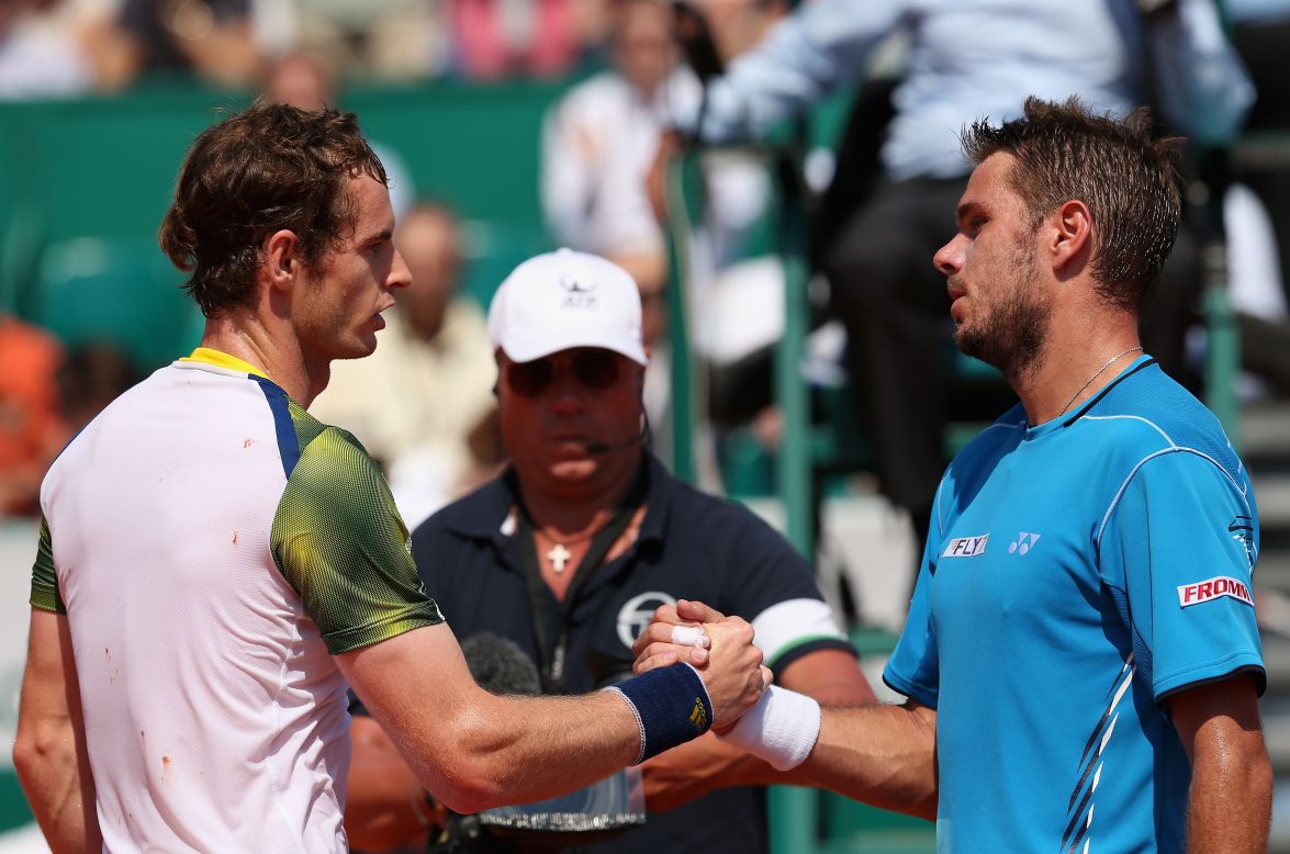 Andy Murray, left, crashed out with a straight-sets defeat by Stanislas Wawrinka which means the British star will lose the world No. 2 ranking to the Swiss 13th seed's compatriot Roger Federer next week. 