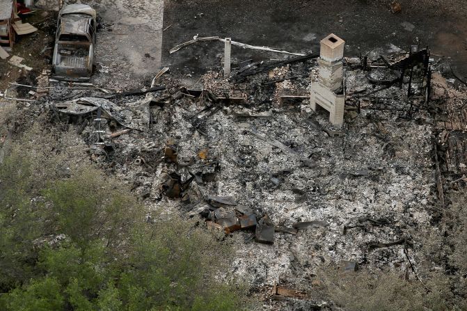 A chimney is the only part of a home left standing after the explosion.