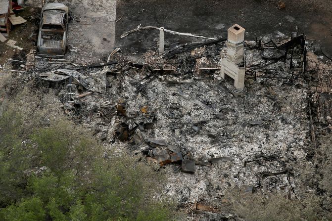 A chimney is the only part of a home left standing after the explosion. 