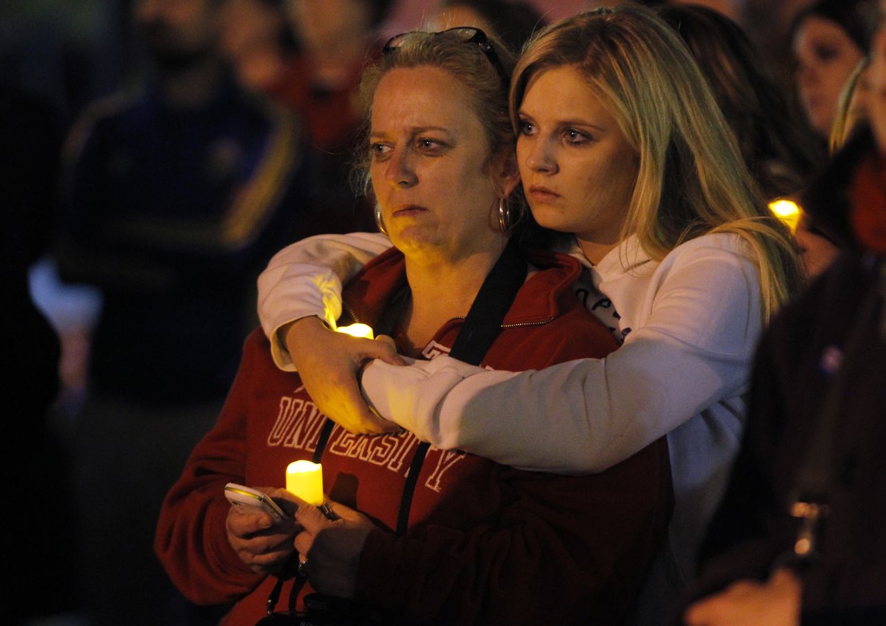Two women embrace during a candlelight vigil in Somerville, Massachusetts, on April 18, 2013. 