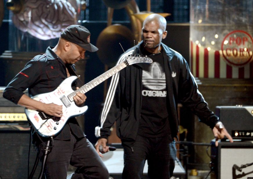 Rage Against the Machine guitarist Tom Morello, left, and Run-DMC's Darryl McDaniels perform onstage.