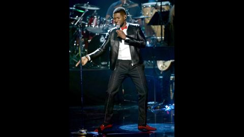 Usher performs onstage.