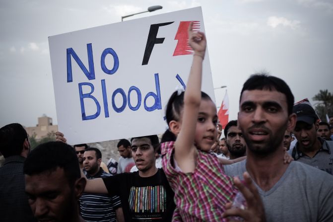 A Bahraini protestor holds up a poster against the country's upcoming Formula One Grand Prix during a demonstration in the village of Jid Ali, north-east of Isa Town. Protesters in Bahrain plan to step up demands for reform ahead of Sunday's race.