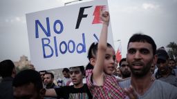 A Bahraini protestor holds up a poster against the country's upcoming Formula One Grand Prix during a demonstration in the village of Jid Ali, north-east of Isa Town. Protesters in Bahrain plan to step up demands for reform ahead of Sunday's race.