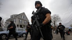 Police officers search house to house for the second suspect in the Boston Marathon bombings in a neighborhood of Watertown, Massachusetts April 19, 2013. Black Hawk helicopters and heavily armed police descended on a Boston suburb Friday in a massive search for an ethnic Chechen suspected in the Boston Marathon bombings, hours after his brother was killed by police in a late-night shootout. REUTERS/Brian Snyder (UNITED STATES - Tags: CRIME LAW) REUTERS /BRIAN SNYDER /LANDOV   Photographers/Source: BRIAN SNYDER/Reuters /Landov  