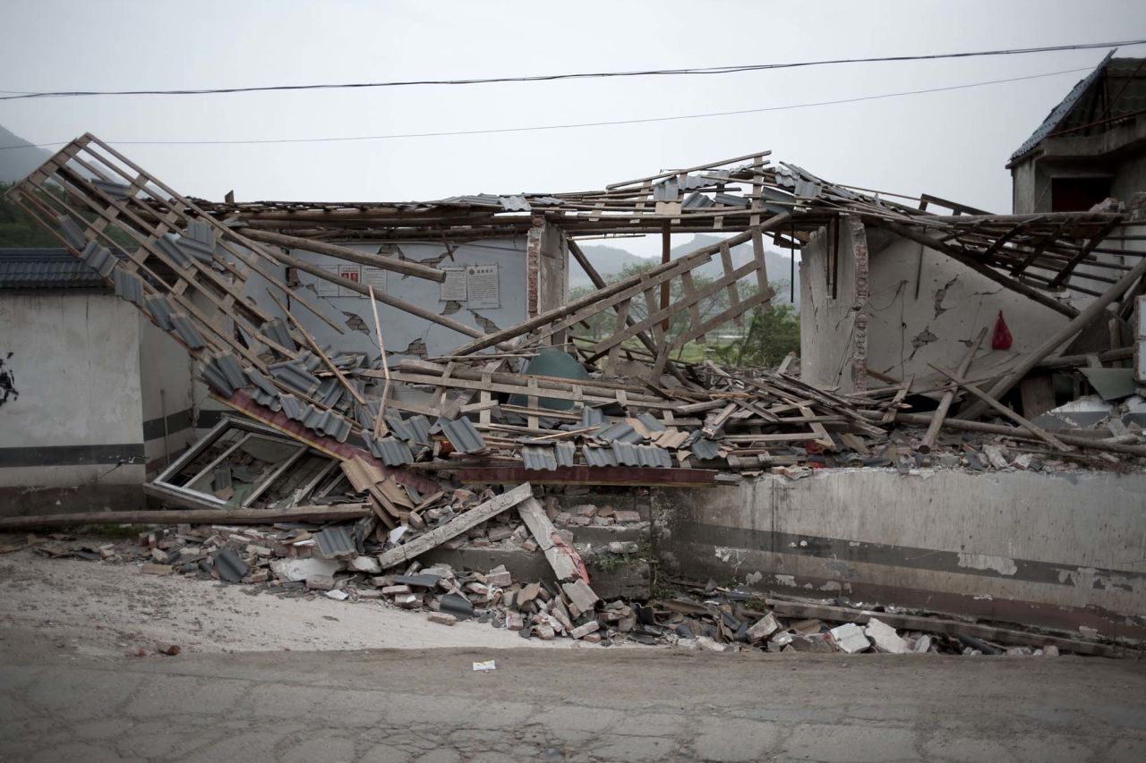 A collapsed house sits in Gucheng Village.