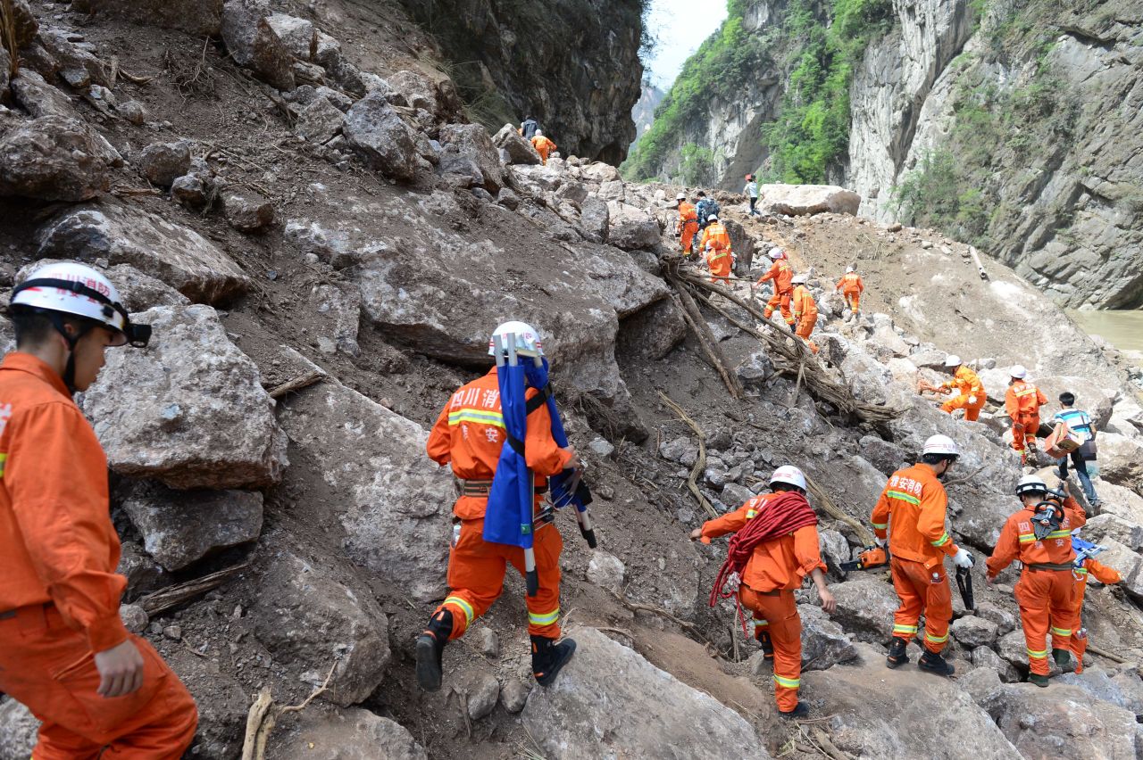 Rescuers head for Baosheng township on Saturday.