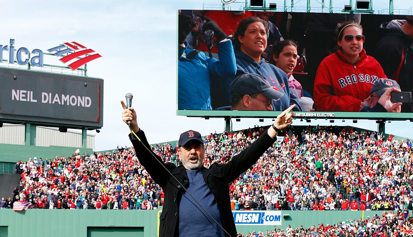 Neil Diamond sings "Sweet Caroline," a song traditionally played at Boston Red Sox home games, during a game against the Kansas City Royals on April 20.