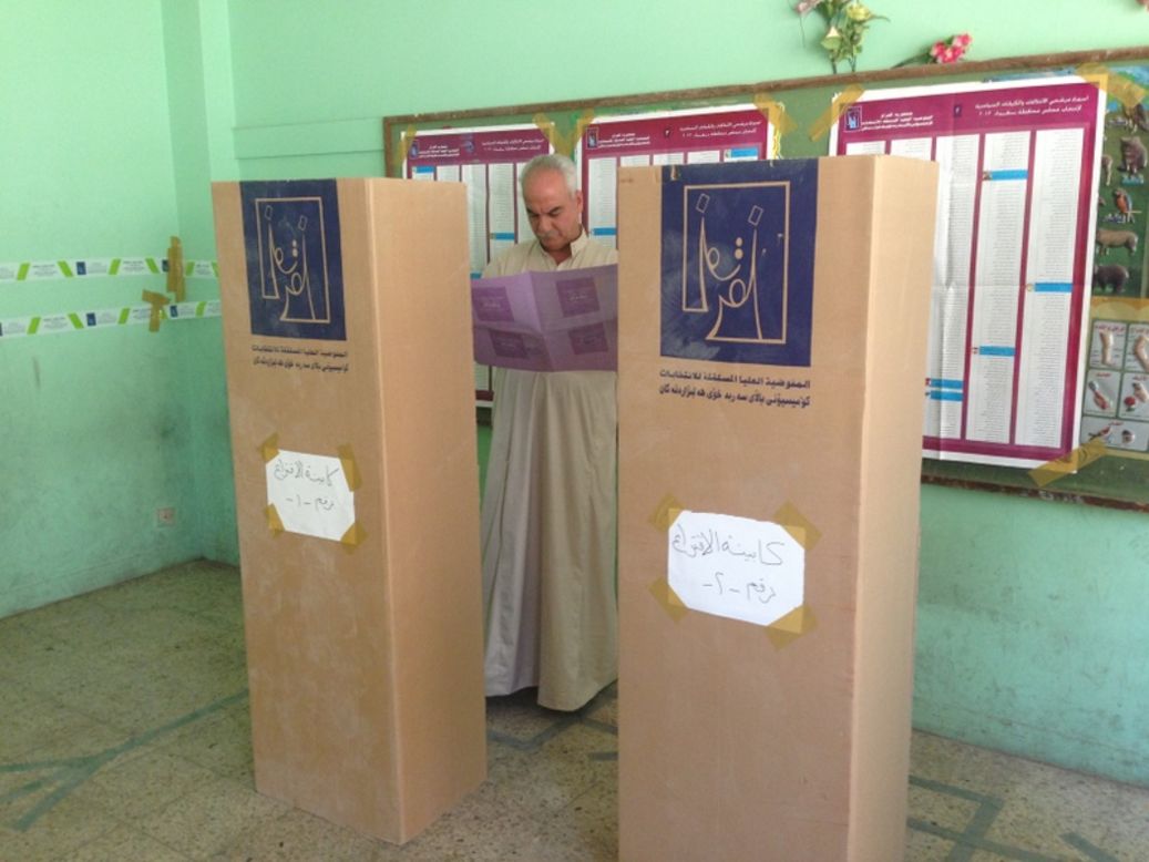 A man reviews his ballot on Saturday. Elections are being held in 12 of the 18 county's governorates. There has been concern that fears over security could affect the outcome of the vote. 