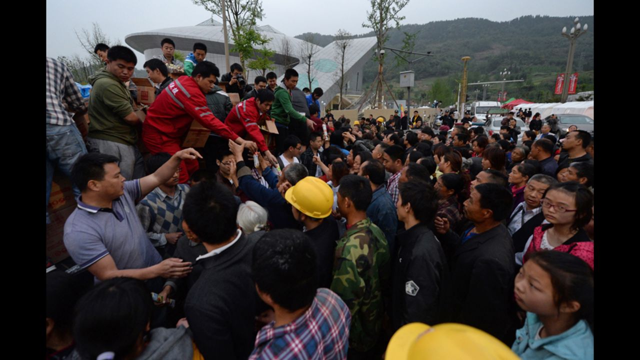 Rescue workers distribute food on Sunday.