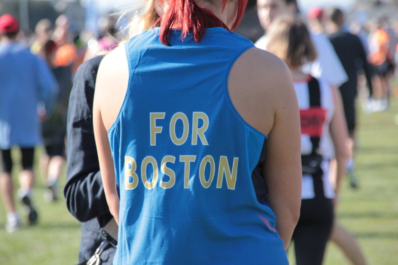 Thousands of London Marathon runners paid tribute to Boston this morning wearing black ribbons and observing a 30-second silence on the start line. Here one athlete customized her shirt with the words 'For Boston' on the back. 