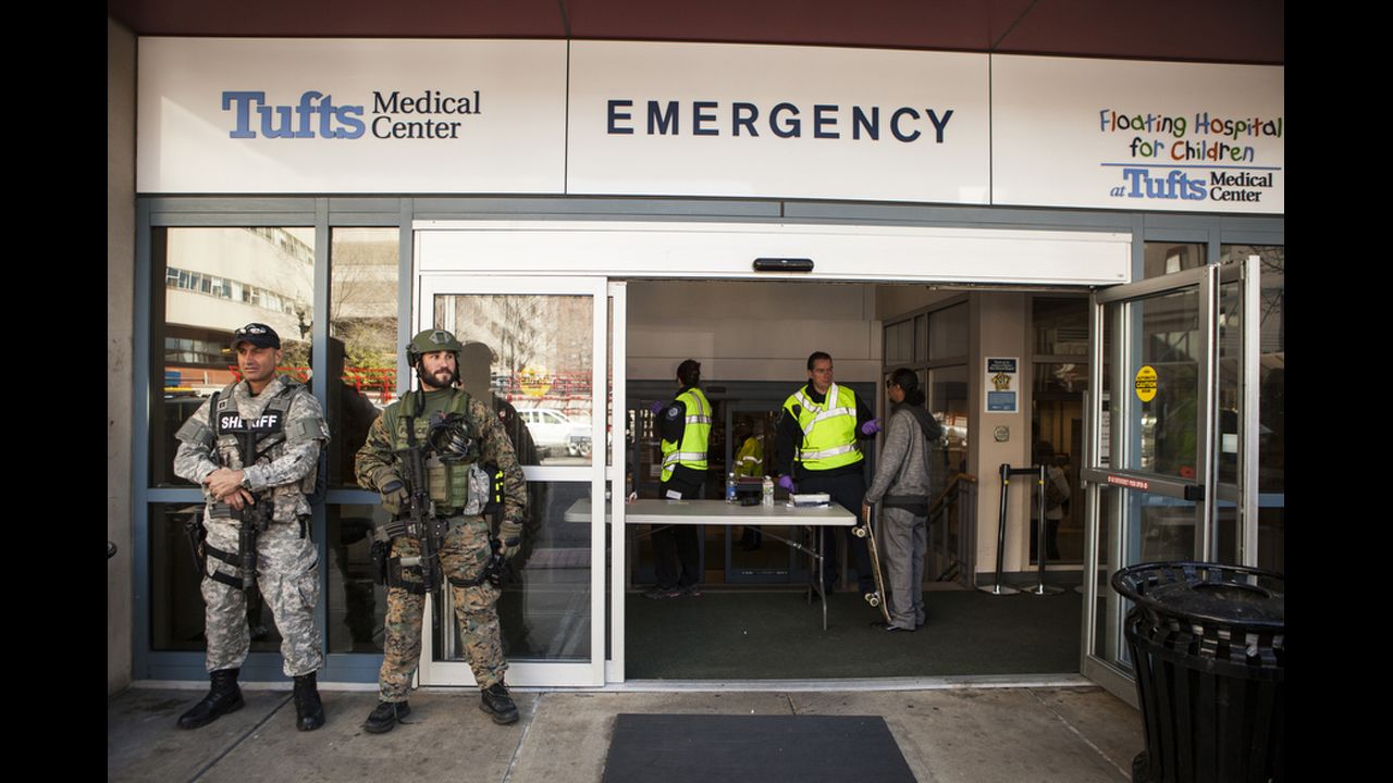 SWAT team members guard the Tufts entrance.
