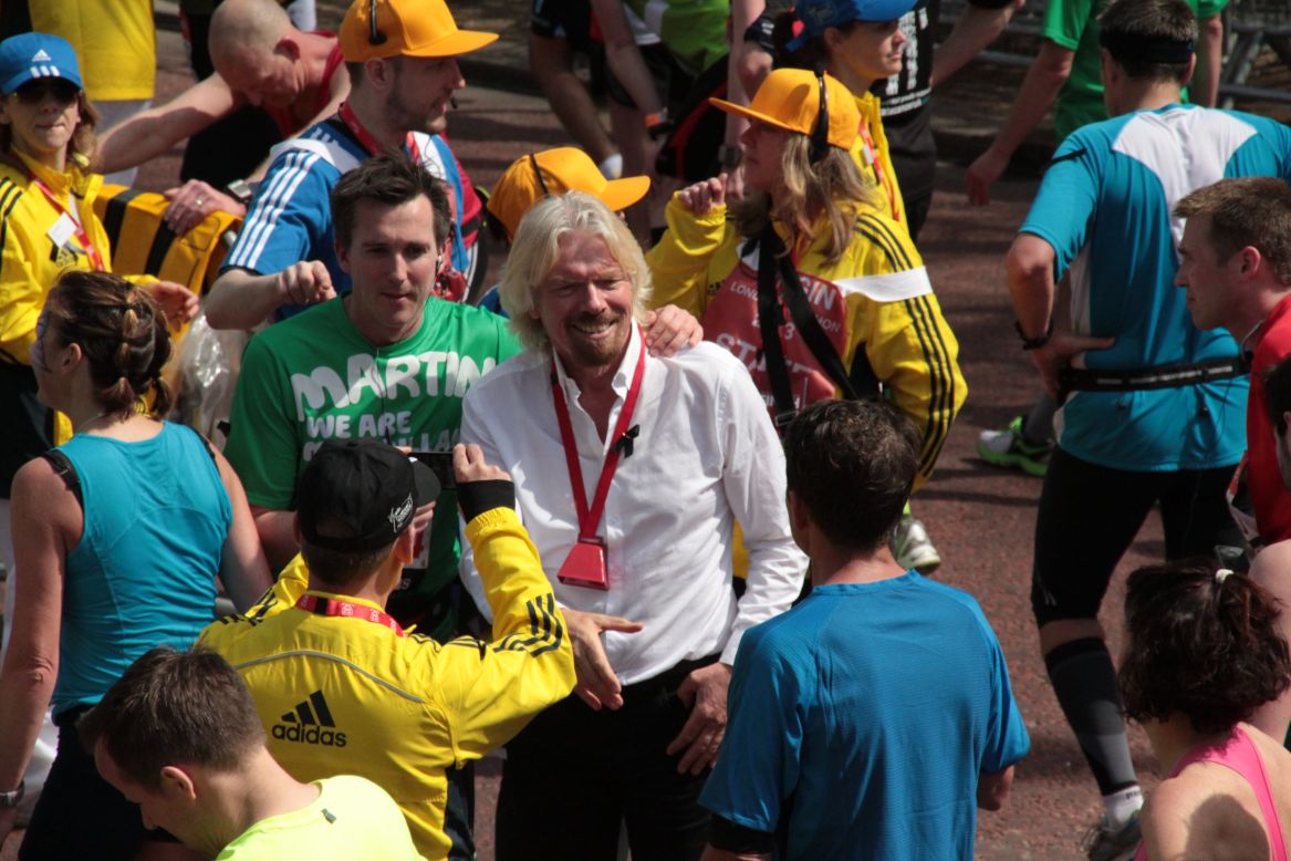 Virgin Group founder Richard Branson was at the finish line to greet runners as they finished the 26.2-mile race.