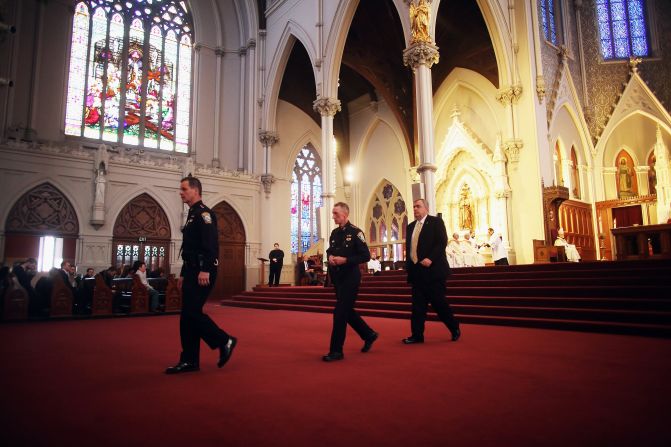 From left, Boston Police Department Superintendents Kevin Buckley and William Evans attend Mass with Police Commissioner Edward Davis on April 21, 2013.