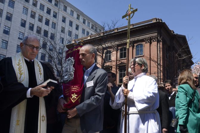 Leaders of an interfaith service participate in a vigil near the finish line on April 21, 2013.