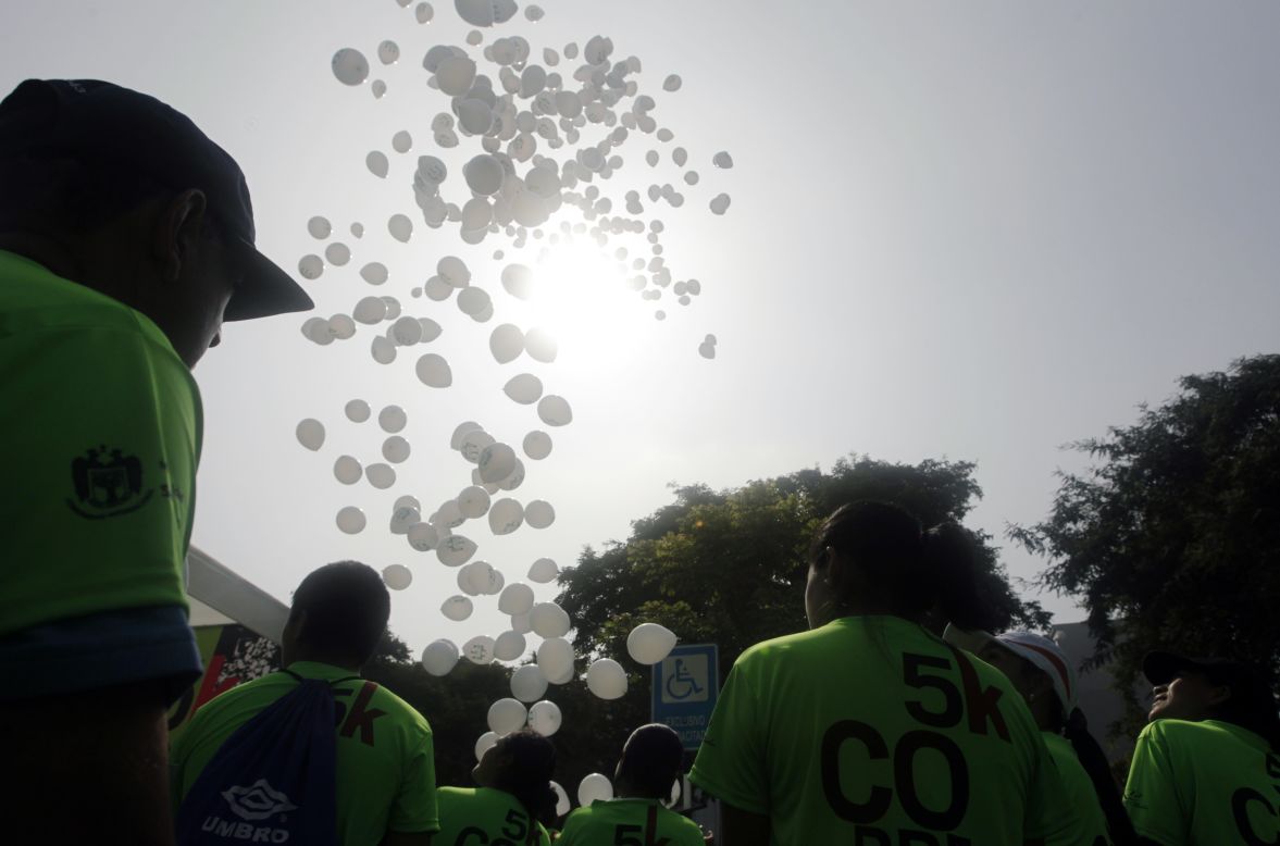 White balloons are released in remembrance of the Boston Marathon bombings victims before the commencement of the 5K San Isidro Run in Lima, Peru, on April 21.