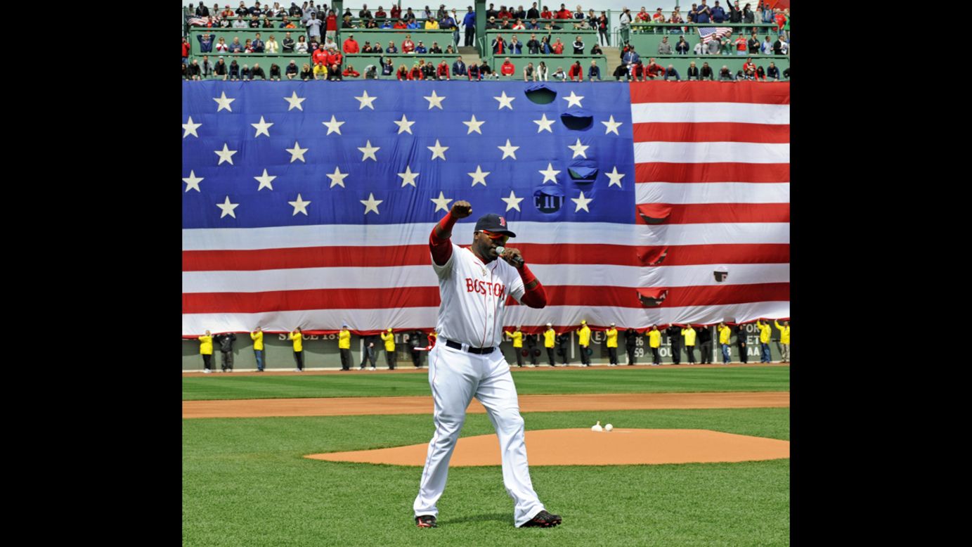David Ortiz of the Boston Red Sox speaks to the crowd during a ceremony held in honor of the bombing victims before a baseball game against the Kansas City Royals at Fenway Park in Boston, on Saturday, April 20.