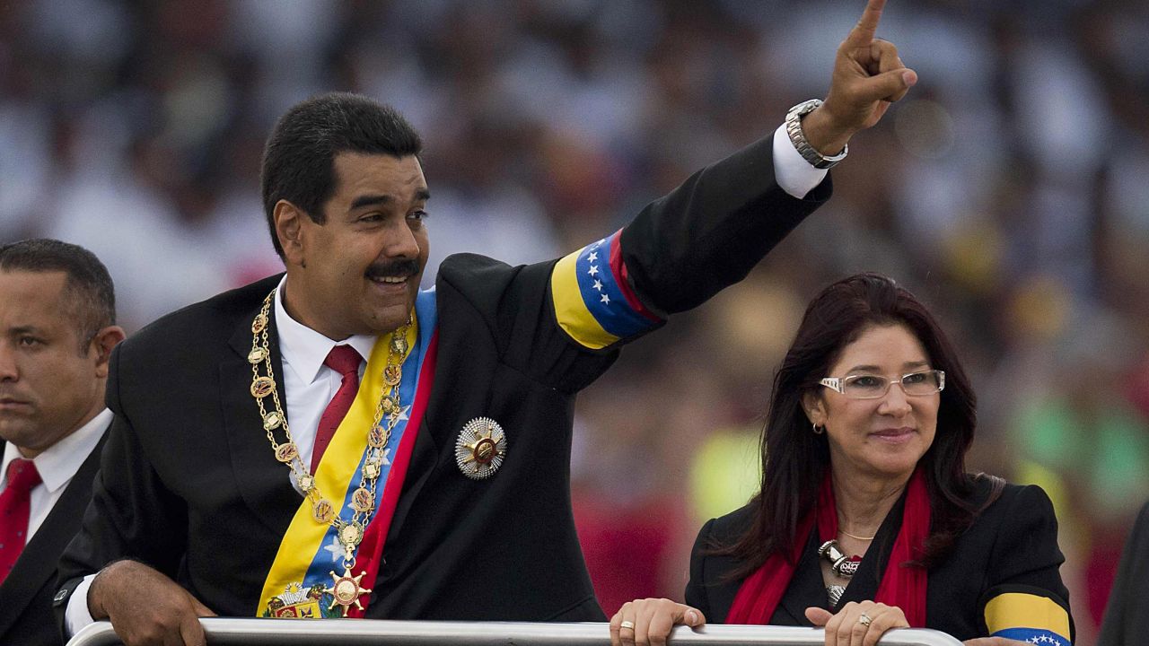 Venezuelan President Nicolas Maduro waves to the crowd during a motorcade after his installation in Caracas on April 19.