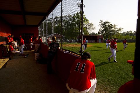The Cairo High School baseball team waits between innings during a game against Americus-Sumter High School. The field at the school is named after Robinson.