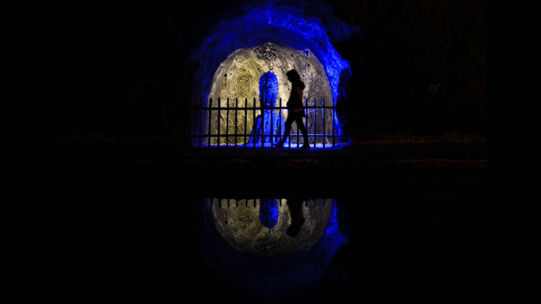 A visitor walks past a statue of the Virgen del Perpetuo Socorro (Our Lady of Perpetual Help) in the Nemocon salt mine in September 2012. The mine is one of Colombia's most popular tourist attractions. 