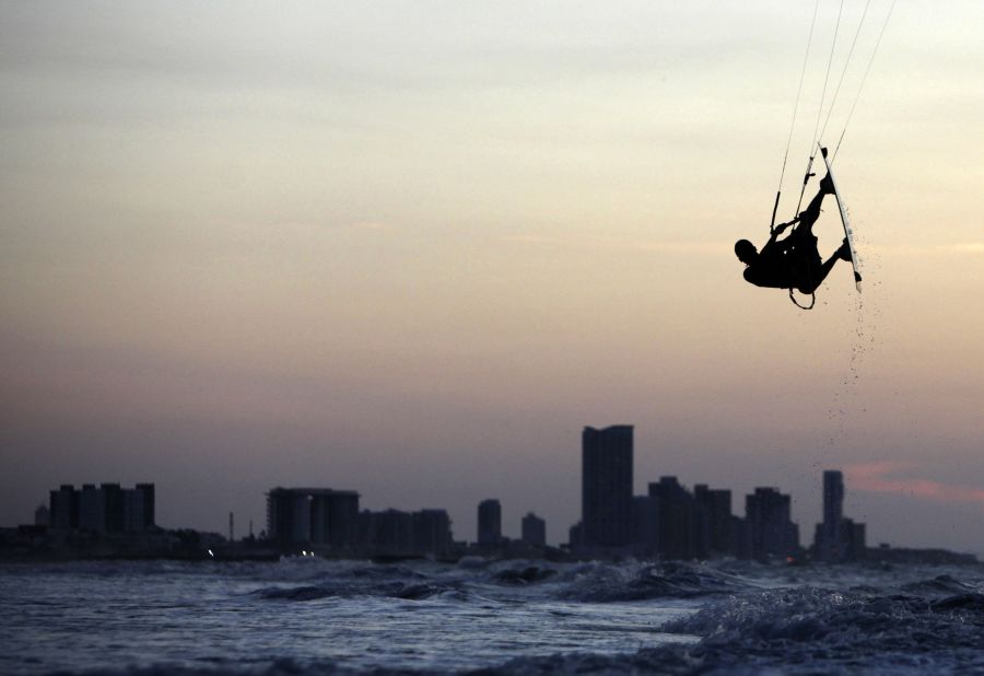 A coastal country with deserts and mountains between its borders, Colombia draws the adventurous tourist with its varied terrain. Bocagrande beach in Cartagena is popular with kitesurfers during the warm season, which lasts from December till April. Kitesurfer Ken Ruiz practices at Bocagrande beach  in December 2012. 