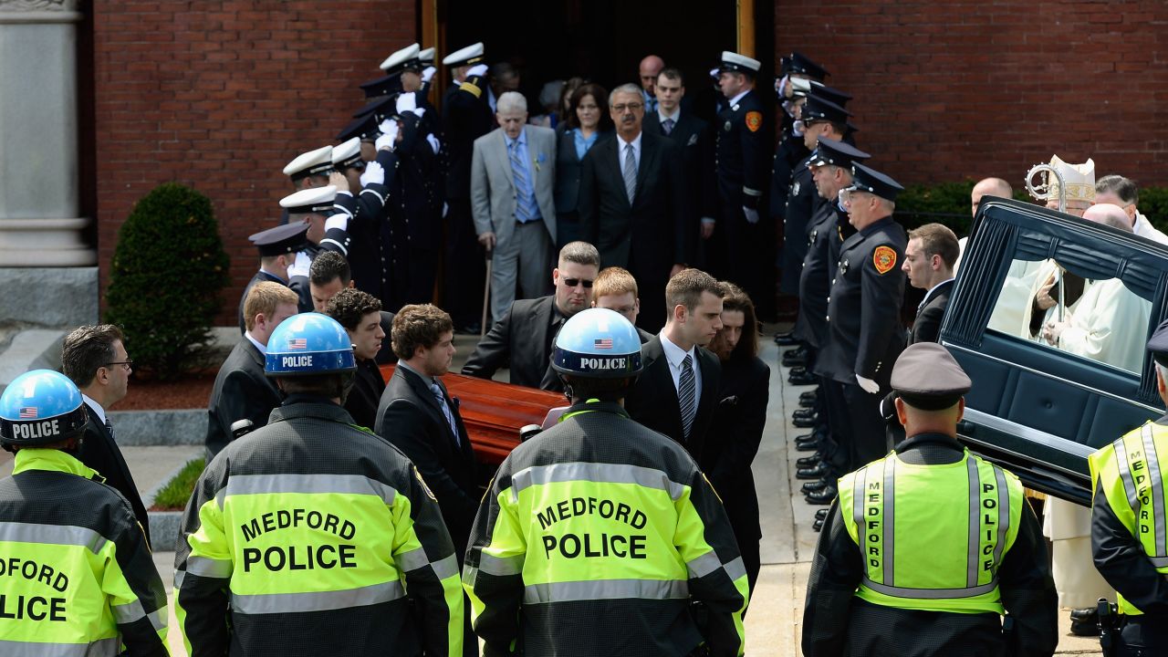 Pallbearers carry Campbell's casket after a funeral service in Medford, Massachusetts, on April 22, 2013.