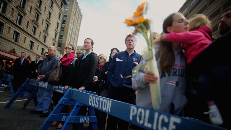 One week after the bombings, people gather to observe a moment of silence in Copley Square.