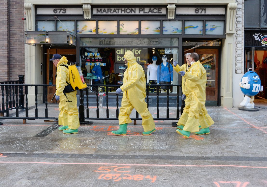 The Boston Fire Department Hazardous Materials team cleans the first blast site near the finish line of the Boston Marathon on April 22.