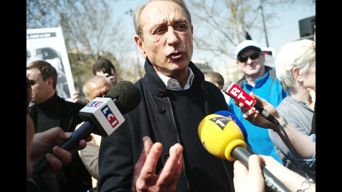 Paris Mayor Bertrand Delanoe speaks to journalists at Bastille Square during a pro-gay rights demonstration on Sunday.