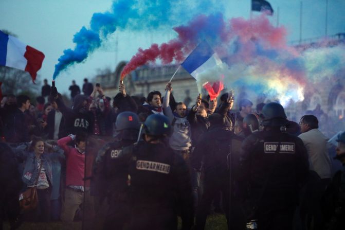 Opponents of a gay marriage bill face riot officers at "La Manif Pour Tous," or demonstration for all, on Sunday, April 21.